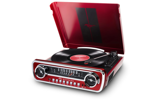 There are plenty of Mustang styling cues on this turntable including the running horse logo and Le Mans stripes under its hood. However it is the replica 1965 Mustang speedometer/radio tuner that really gives it that automotive feel.