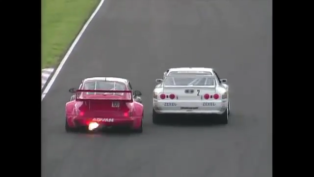 Tsuchiya, in his flame-spitting Porsche, tries another dive down the inside.