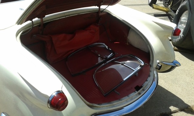 With removable glass side windows, and no outside door handles. The vent windows were the only access to the inside door knobs when the top was up.