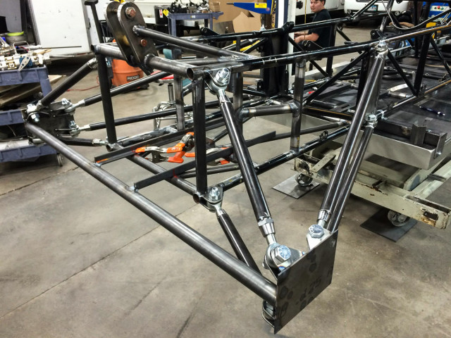 Mockup of the rear suspension system for the Arrow. The flat plates at the end of the arms were later replaced with heavy steel plate for stability. 