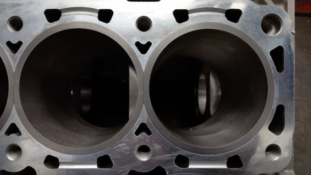 Bear Block Motors opted for conventional flanged cylinder sleeves in its new aluminum Coyote block. The sleeves are much thicker than stock and unlike the cast-in-place Coyote sleeves, are simple to replace.