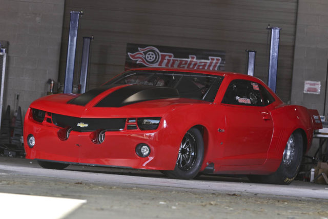 If the Fireball Camaro doesn't quite look like a normal Fifth Gen Camaro, you're on to something. The one-piece nose was custom made exactly how Ryan wanted it. The grille design was changed and the hood was molded in. But the most significant part of the custom nose is the front wheel openings. While the wheelwells retain the factory shape, they have been reduced in scale to better fit the 15-inch front wheels. This gives the smaller wheels and tires a much more natural look on a car that was never intended to have such small wheels.