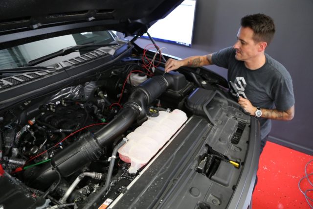 Jonas Cooper, Chief Technology officer at Lethal Performance, starts the installation by removing the factory airbox lid and induction tube. At this point, you will also want to R&R the stock spark plugs and gap them down to .025-inch.