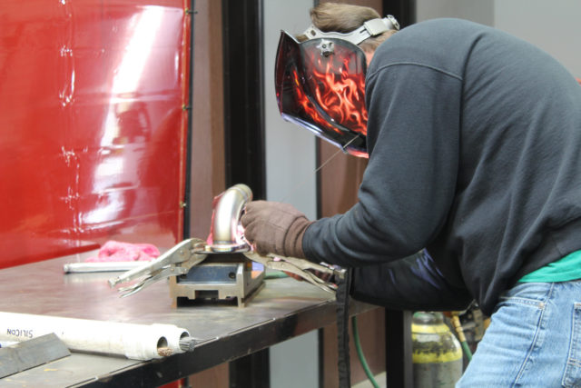 Here Holman tacks tubing sections together.
