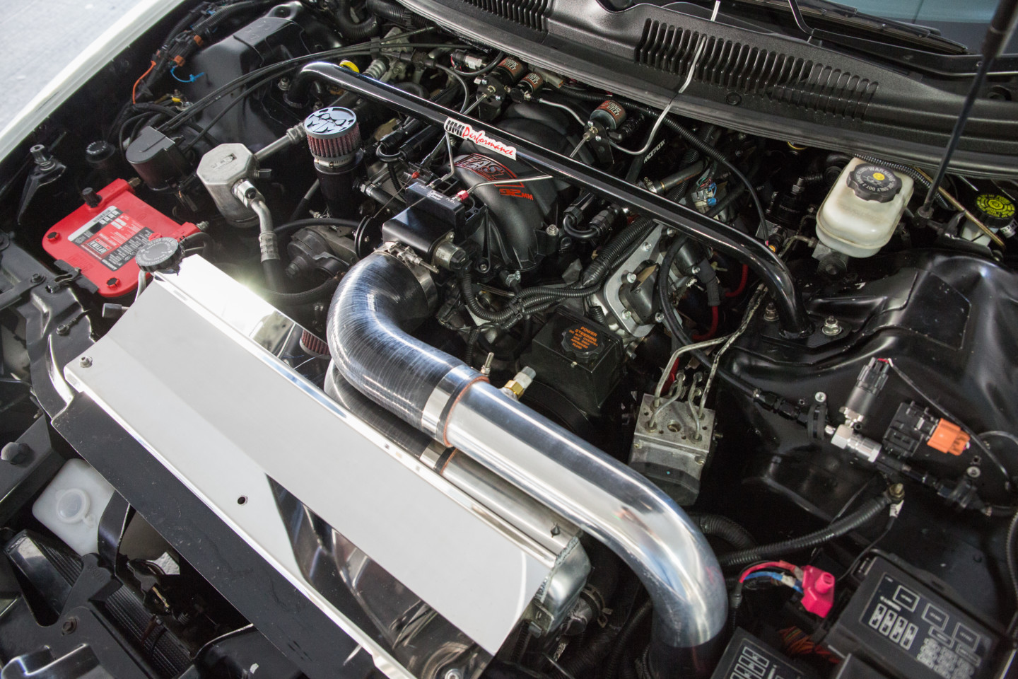 A 6 liter motor sits in the 2002 Camaro's engine bay. 