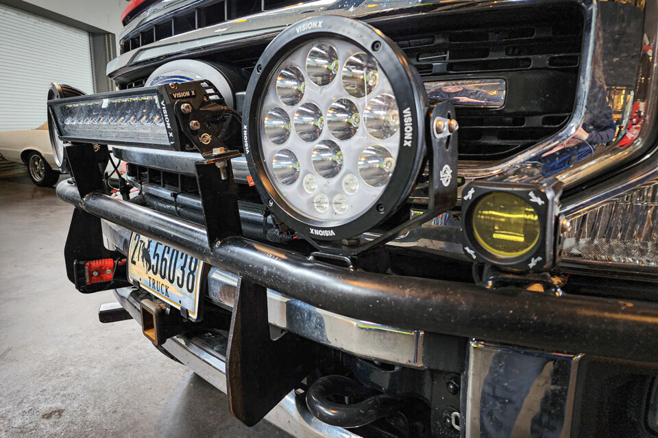 Light bar, auxiliary lights, and chrome grille on customized truck