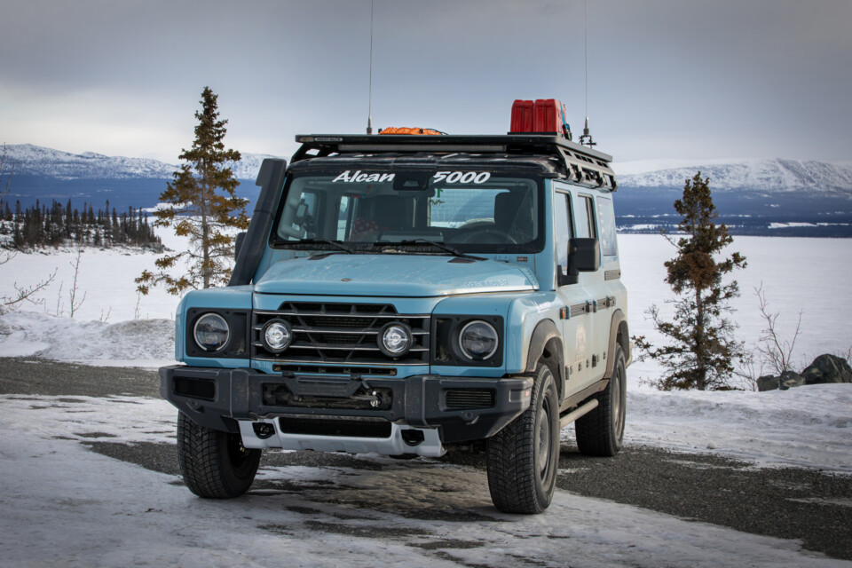 INEOS Grenadier front three quarters sits in front of a frozen waterway in Alaska