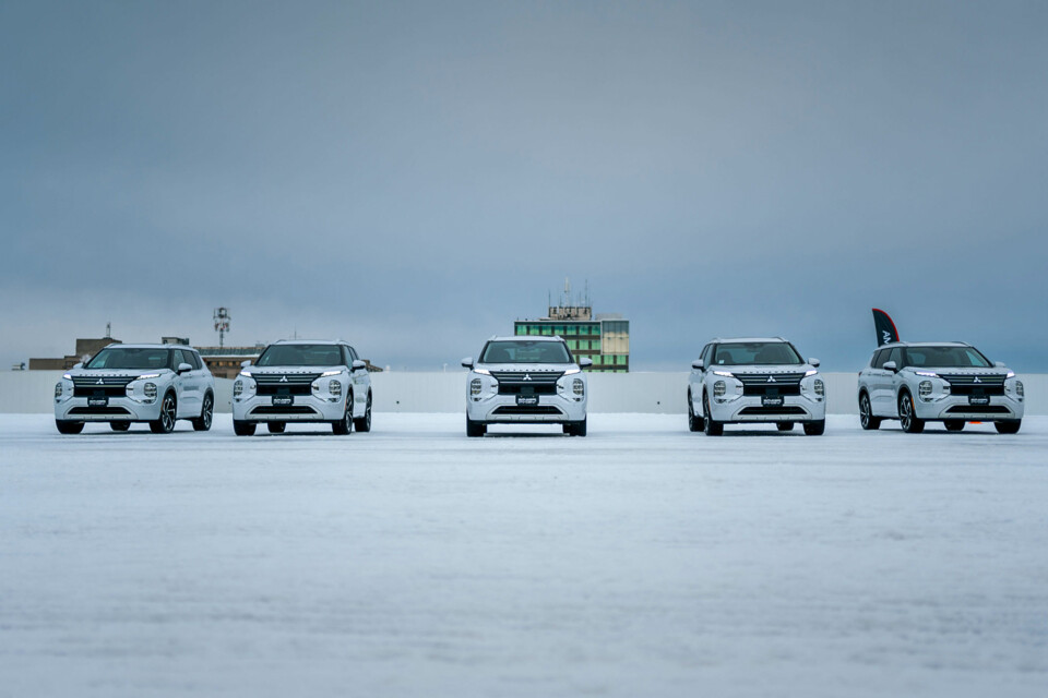 A collection of white Mitsubishi PHEV SUVs.