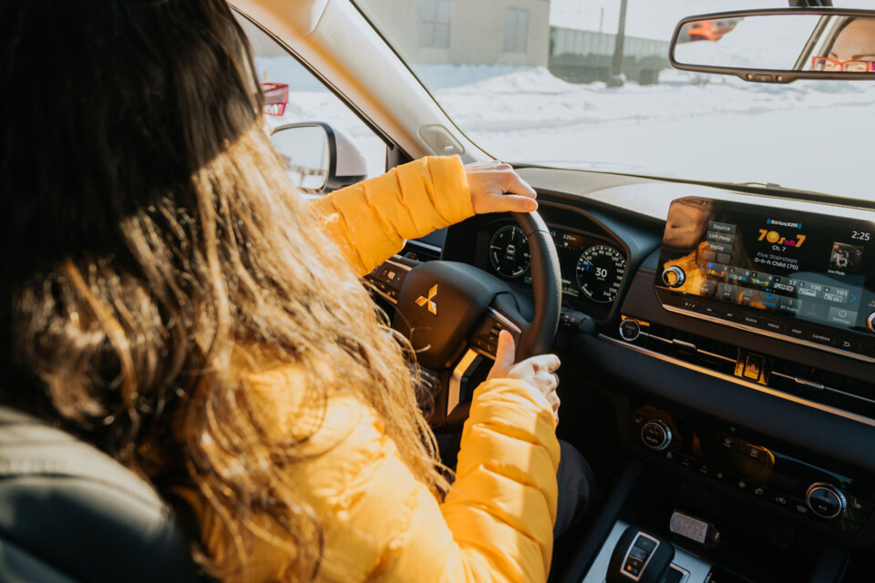 Journalist and fellow OffRoad Xtreme contributor, Mercedes Lilienthal, is wearing a yellow jacket while driving on the ice course.