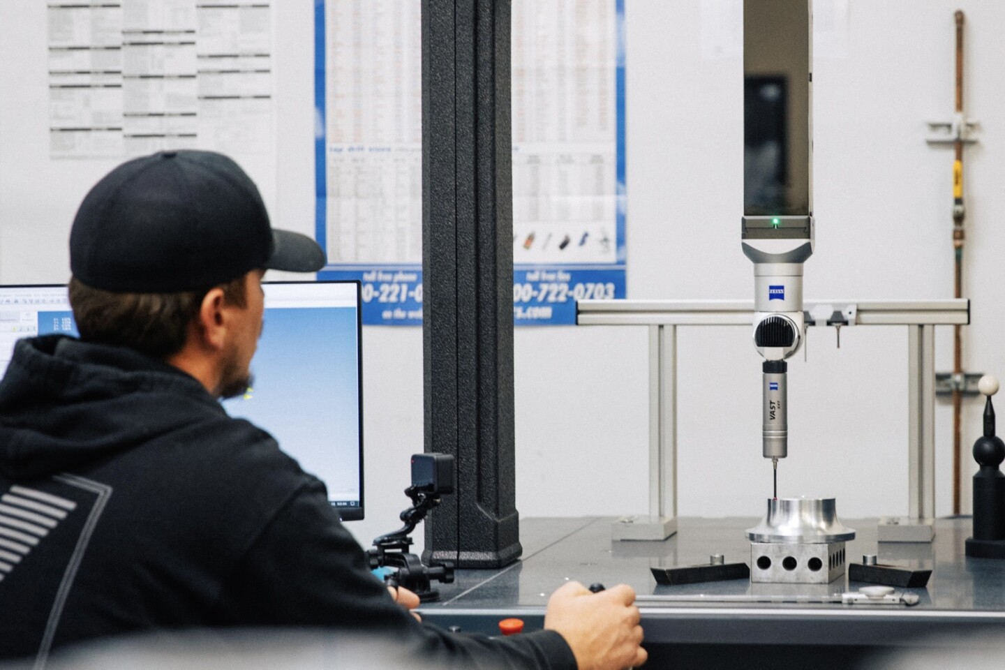 Racing & Performance employee working on a car part
