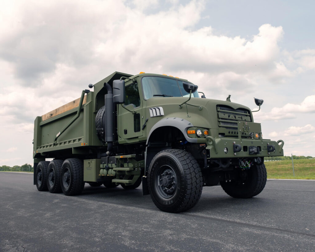 Another Load of Mack Defense Dump Trucks