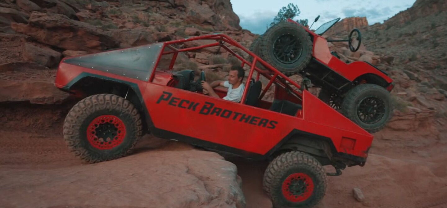 Cybertruck carrying a mini jeep