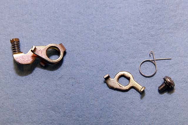Here's a shot of all the components in the fast idle lever assembly broken apart. Keep the stuff on the right. Ditch the big lever on the left.