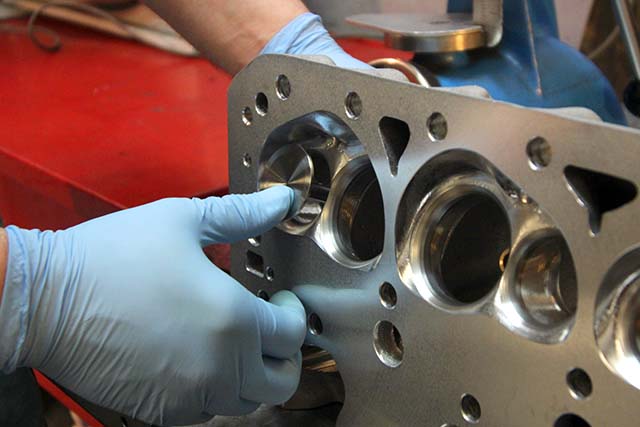 If the seats are worn, they will have a tendency to "grab" the valve. If the seat is good, a valve will bounce off of it.