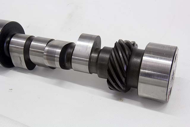 When roller cams first appeared, they were generally machined out of a very hard 8620 or even 9310 alloy steel core. These cams require a soft, bronze alloy distributor gear. More recently, cam companies like Comp can press an iron gear on the end of the shaft to accept a stock iron distributor gear for street use. One difficulty is determining the gear material on an unknown cam. Steel cams can sometimes (but not always) be identified by the copper surface color between the lobes. These cams usually run the same alloy steel gear, but it is possible to have an iron gear grafted to the cam as an option.