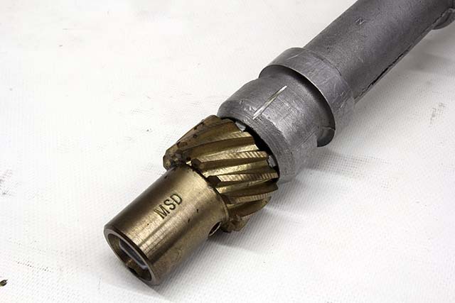 One way to extend distributor gear life on a small- or big-block Chevy is to mark the location of the distributor, remove it and cut a 0.030-inch slot in the distributor body’s lower sleeve. This will direct pressurized oil at the cam and distributor gear.