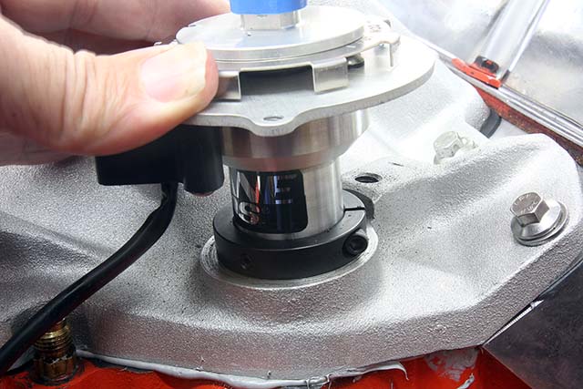To custom set the distributor height, first loosen the collar, remove the gasket, and place the distributor in the block, allowing it to bottom completely.