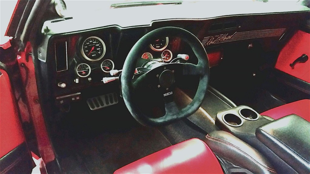 The interior sports all the necessities of a purpose-built street machine/race car, along with those steering wheel mounted paddle shift-ers that deliver high speed gear changes.