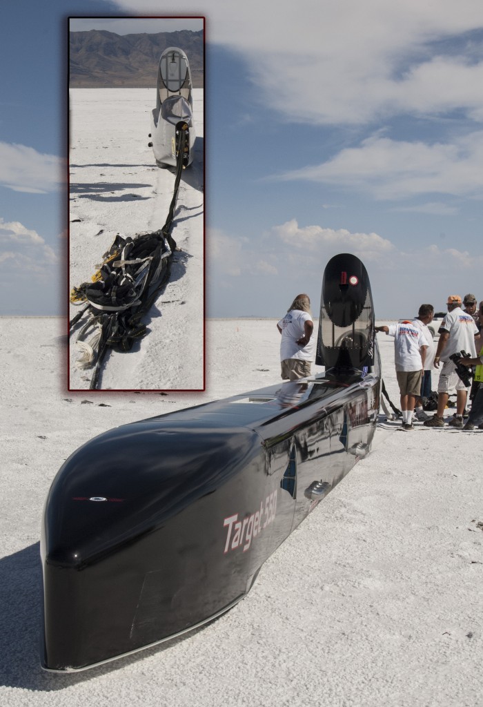 SW2016 Target 550, the streamliner of Marlo Treit and Les Davenport (driver) came to a controlled stop some 9 miles down course and one-half mile off the active track when both ring slot parachutes failed. Treit suspects the canopy size is too small for the 8,000 pound car now approaching the 400 MPH  threashold on its way to the magic 550 mark.  The inset photo shows the complete shredding of the once perfect parachute. “Whooping” is just as important as going,” once astutely said the late Don Vesco who even in death reigns top dog for wheel-driven cars with his 458MPH set in 2001.  Nearly a dozen cars are after his title in 2016, but the lack of solis safe salt has all the fast folks being particularly careful after a 2-year absence due to bad weather coupled with the already super thin crust due to decades of mserable stewardship by the Bureau of Land Management. The racers have engaed elected officals on the state and fedral levels about getting the historic place restored before it is mined bare.